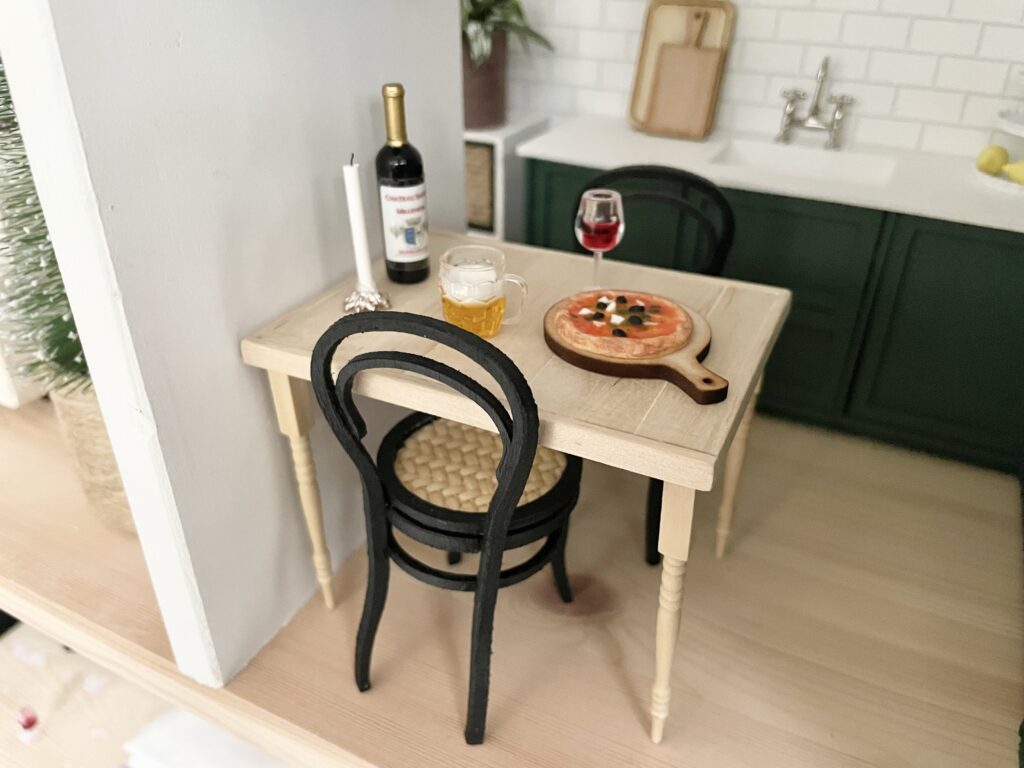 Wooden miniature table in dollhouse kitchen